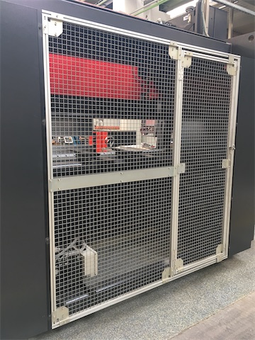 These fixed and moveable guards prevent access from the rear of a sheet folding press.